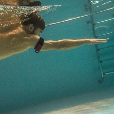 Man using B Strong BFR Band while Swimming
